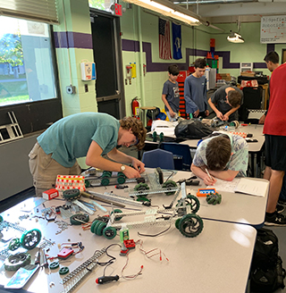 Students building robots in the classroom