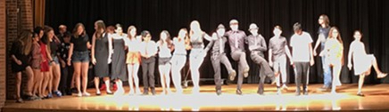Students on stage during chorus line